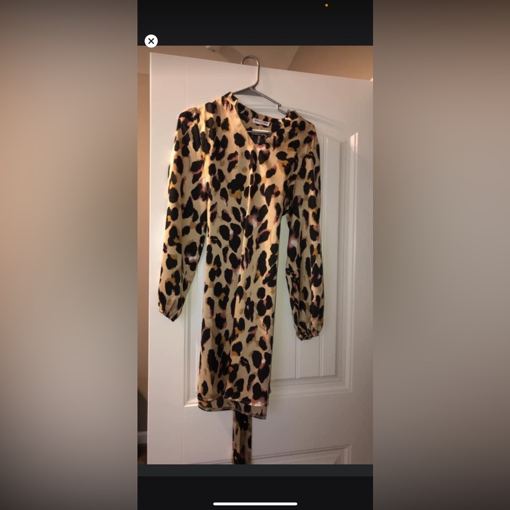 Brand New. Cheetah print silk dress with wrap around tie.